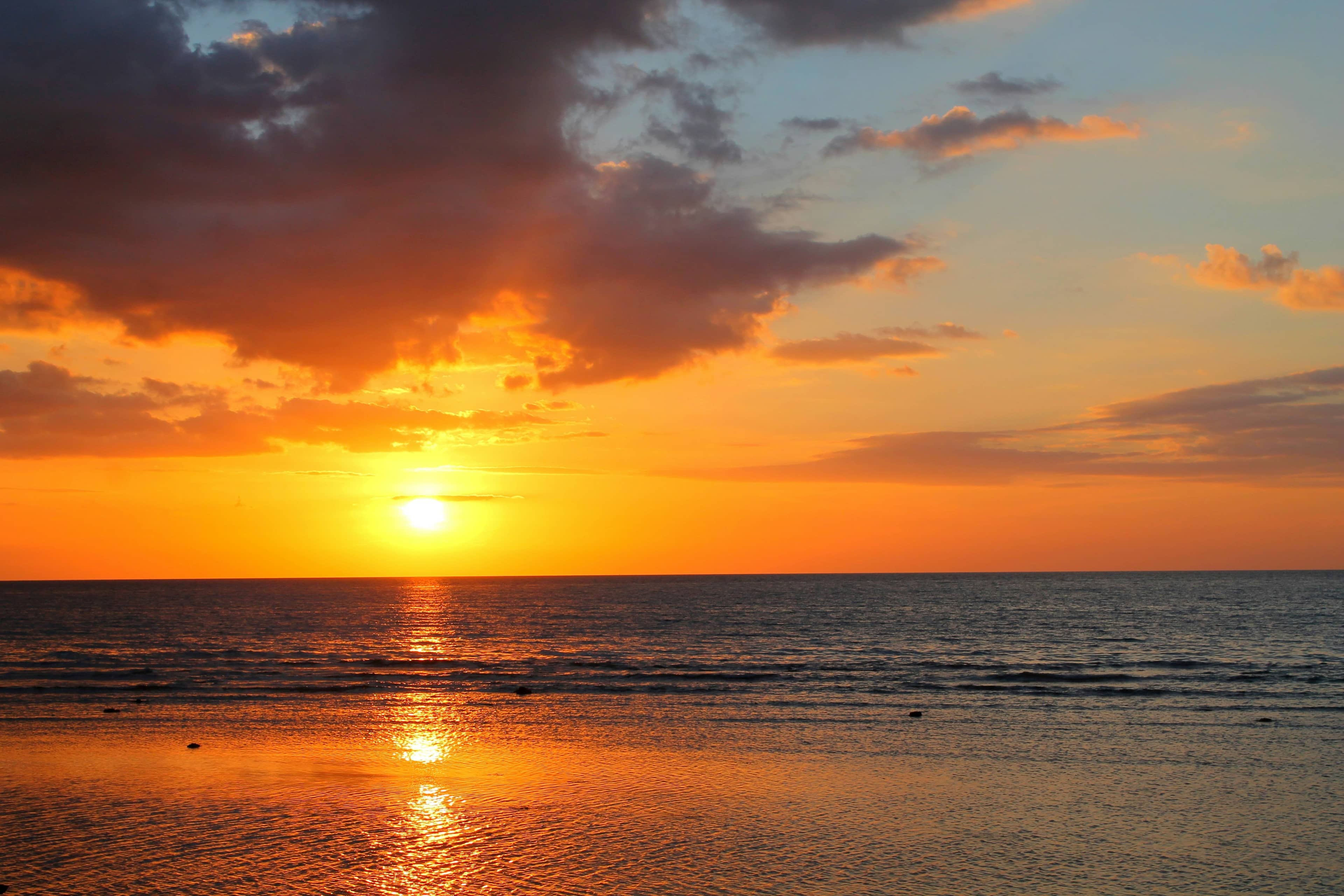 Sunset over the water at Lovina, North Bali