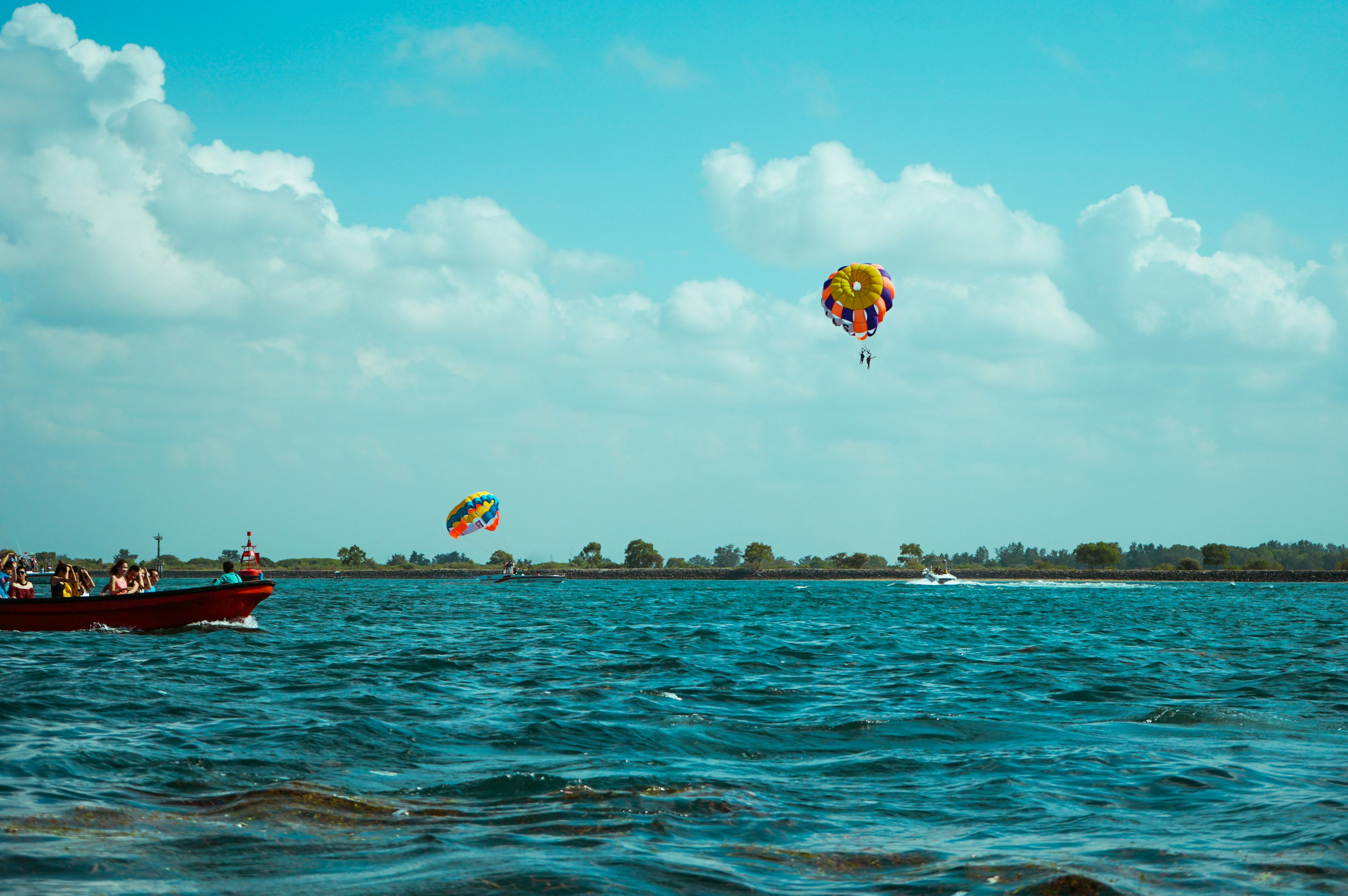 Parasailing over the water at Tanjung Benoa, Bali