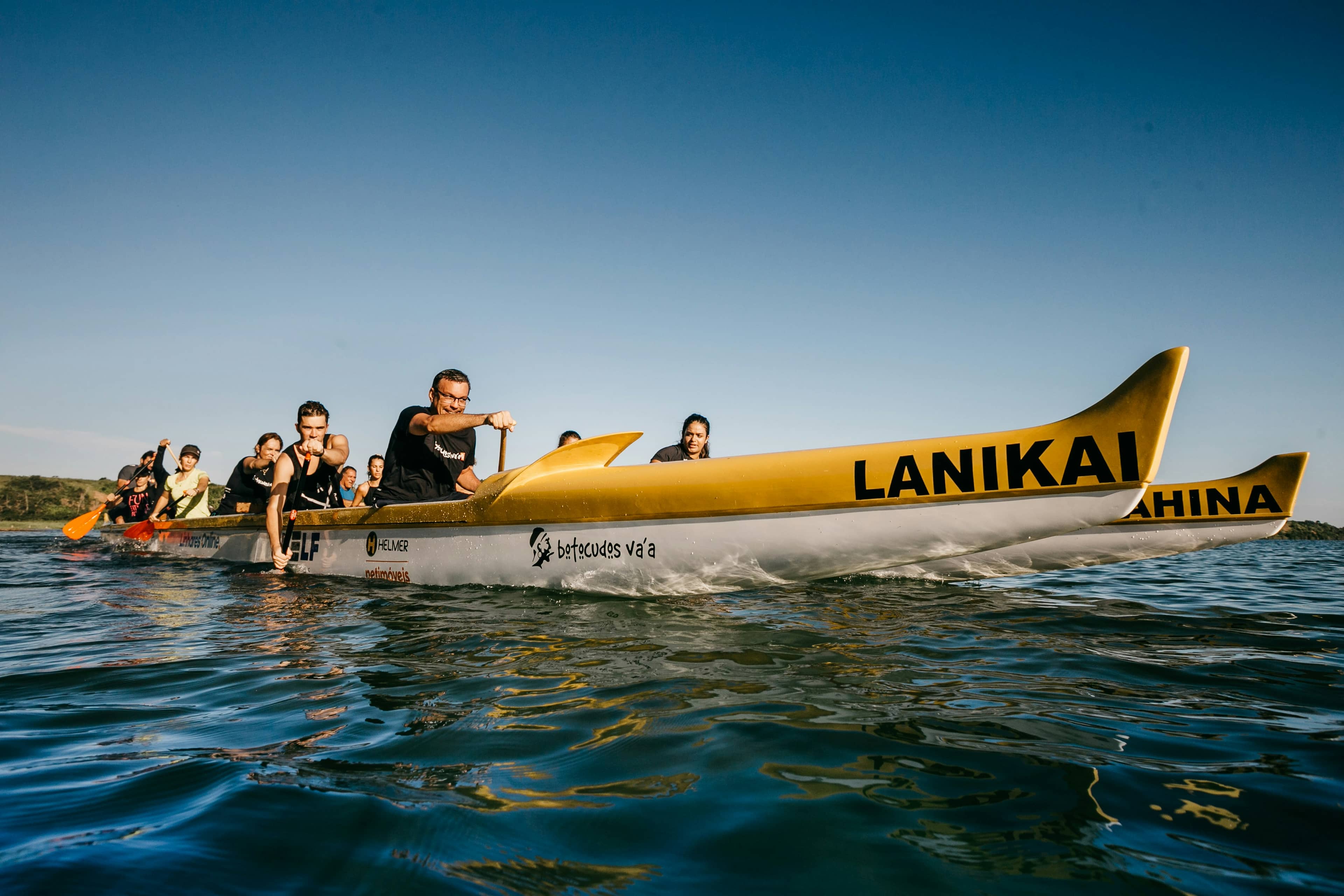 Group riding an inflatable banana boat on the ocean