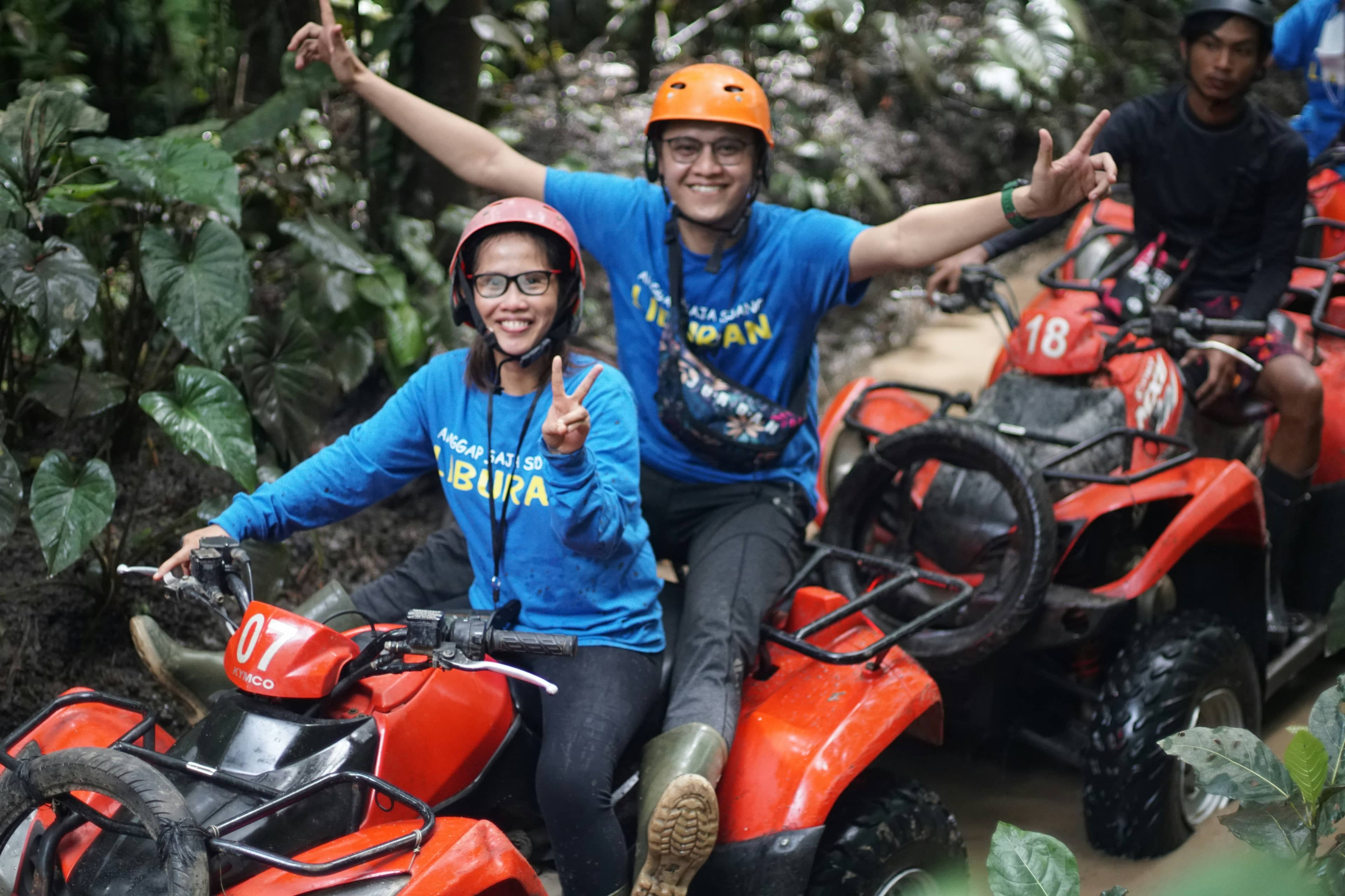 Riders on ATV quad bikes in the jungle near Ubud, Bali