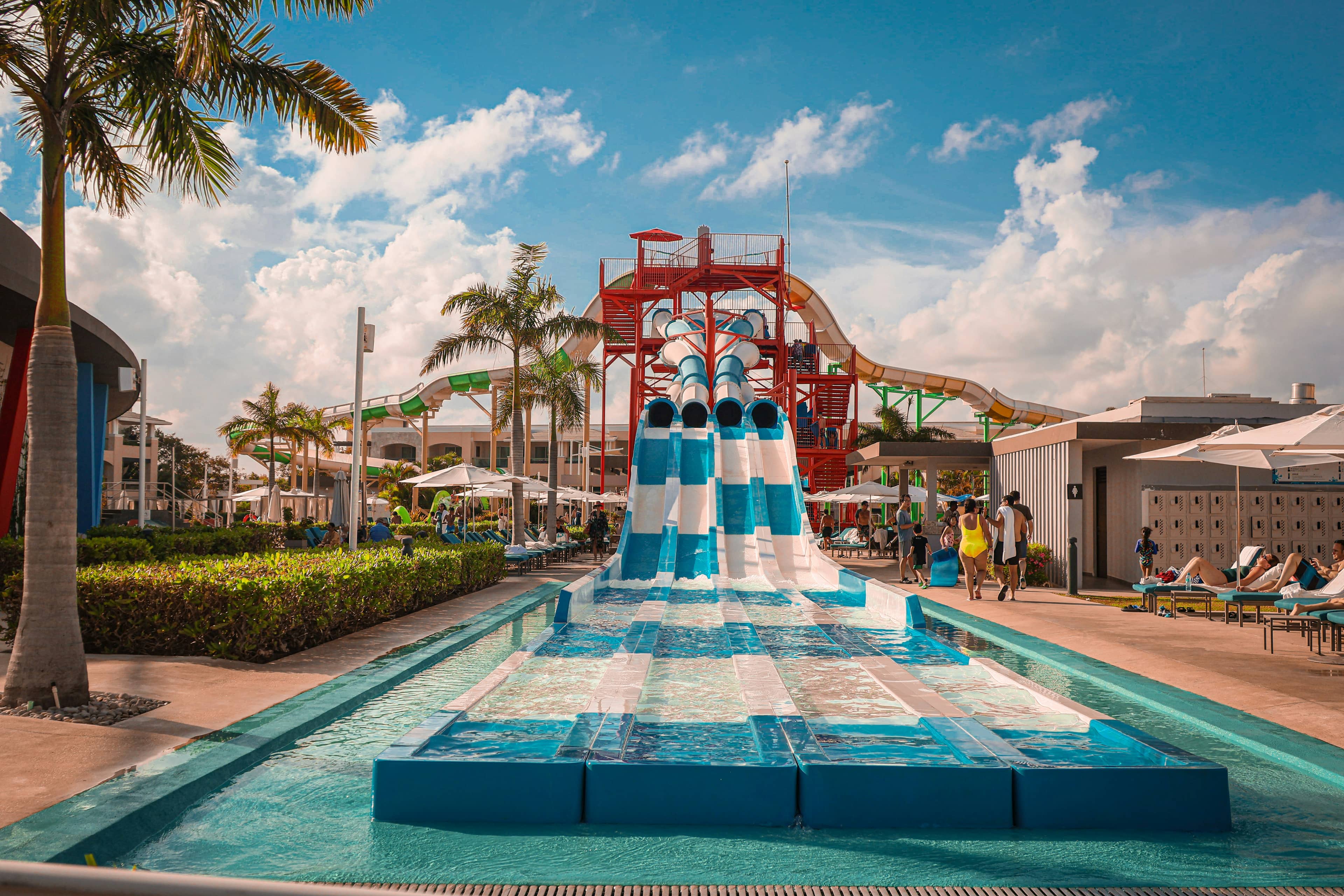 Colorful water park slides and pools on a sunny day
