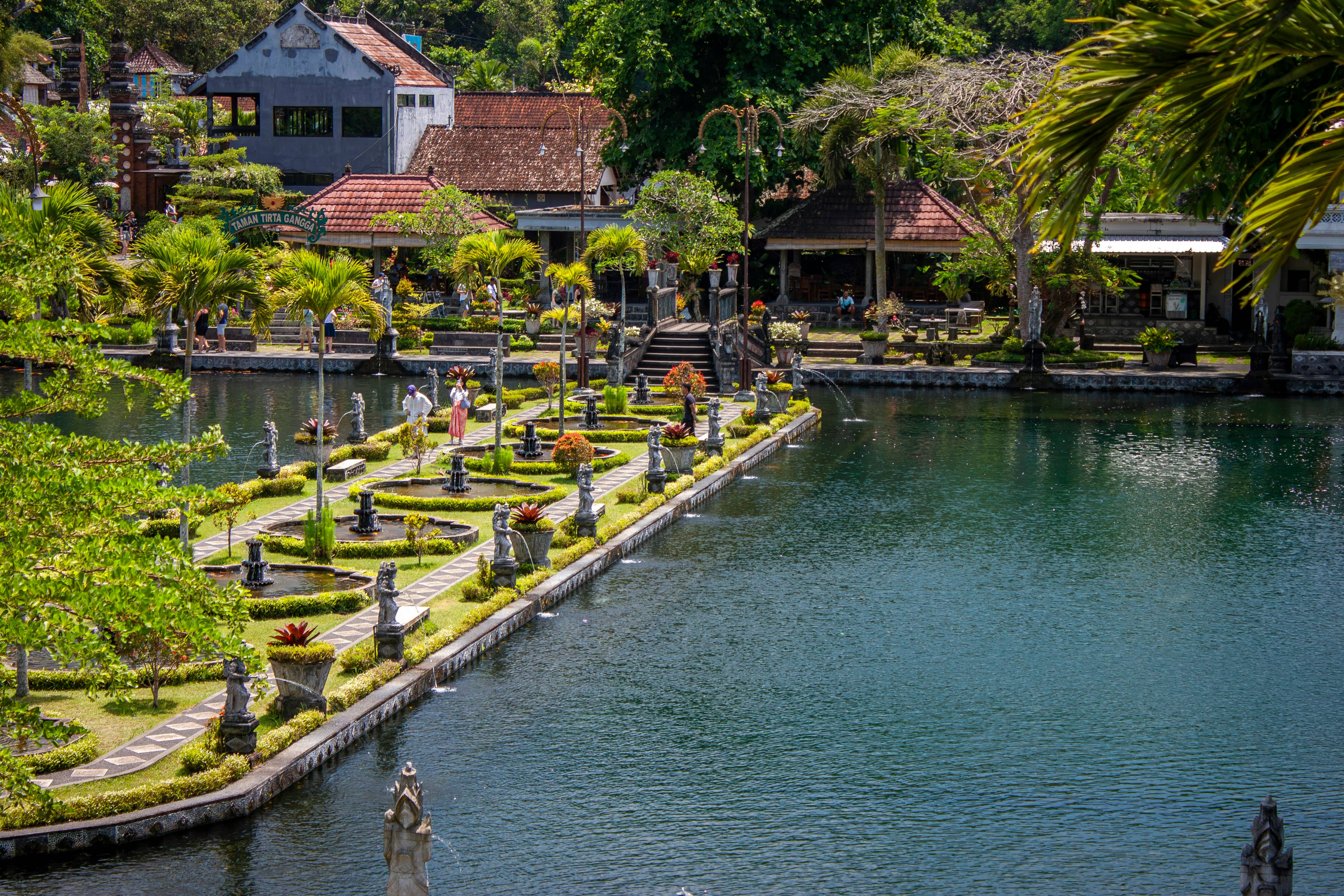 Tirta Gangga water palace with statues and koi ponds, Karangasem, Bali